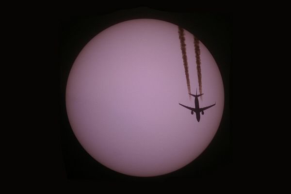 Planes are only rarely crossing the sun - if yes please use professional solar filter!